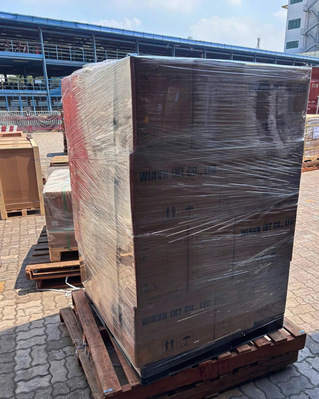 A shrink-wrapped and strapped pallet of coffee wood chews ready for collection