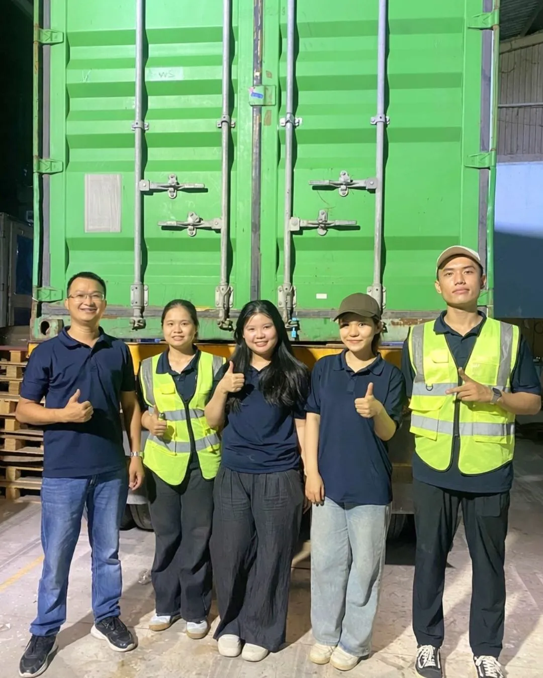 WINVN INT team standing in front of a loaded export container
